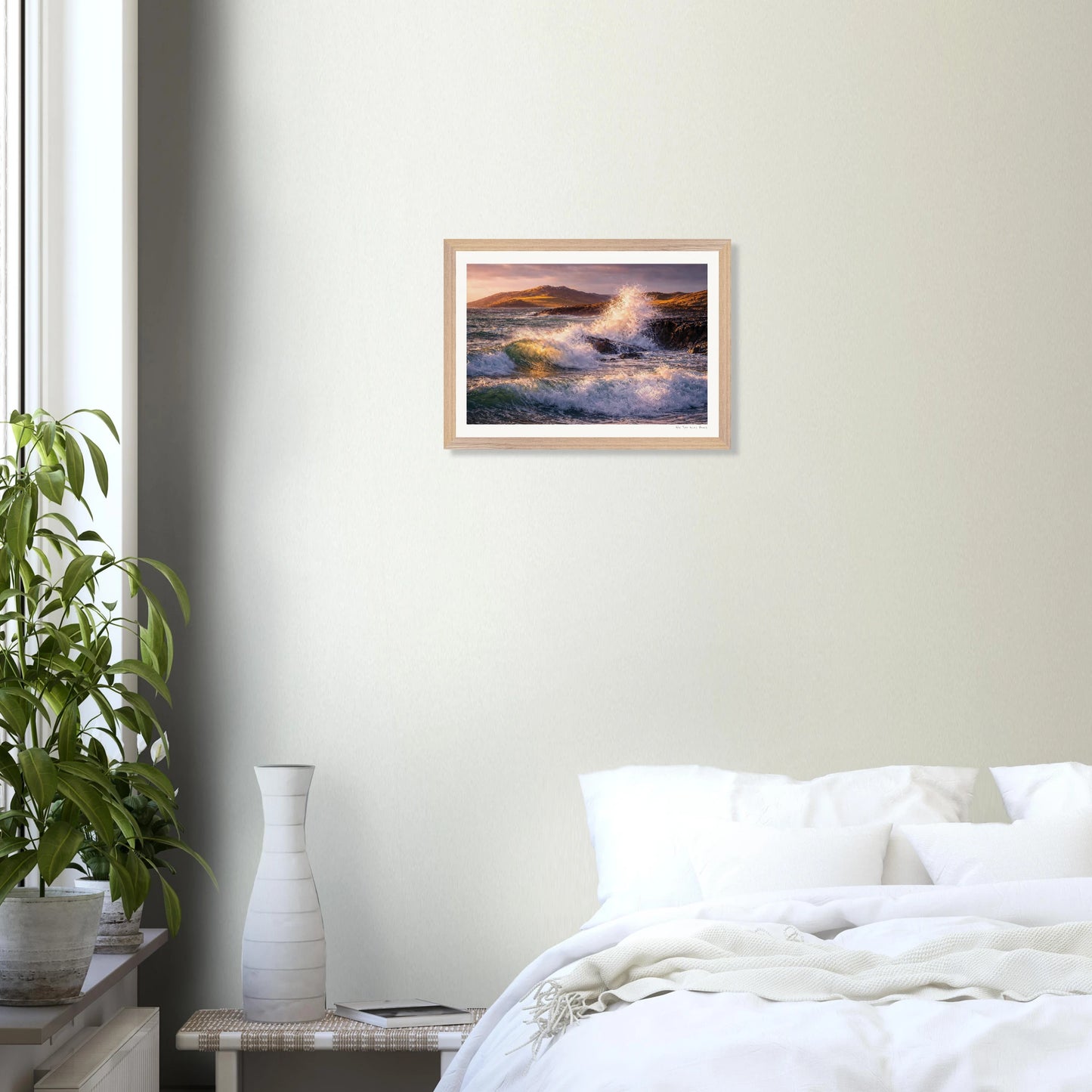 Framed artwork of a seascape above a bed in a bedroom.