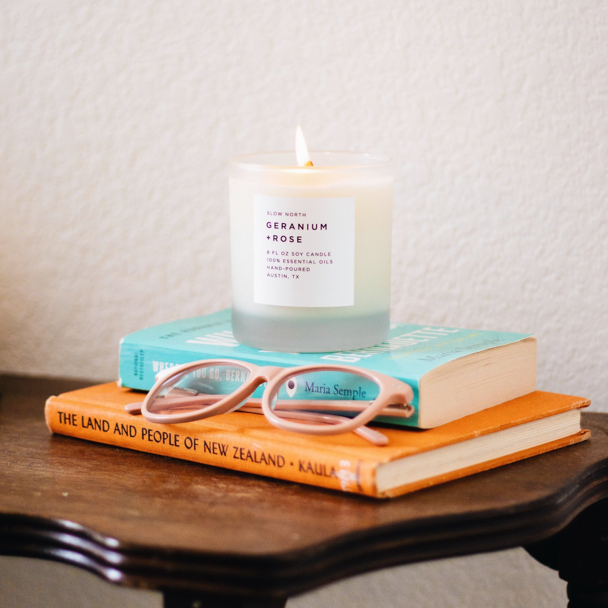 8oz DC-Slow North Geranium and Rose signature candle with a glass jar and floral design, perfect for home fragrance.