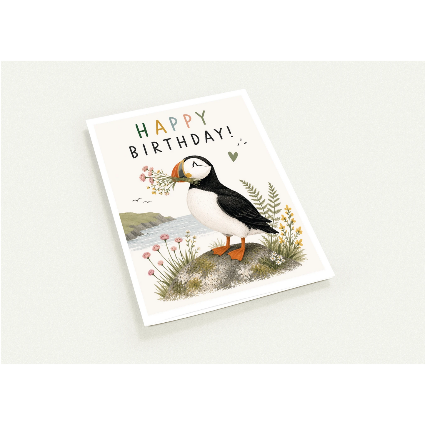 Birthday card with a puffin illustration on a white background