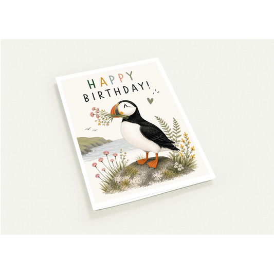 Birthday card with a puffin illustration on a white background