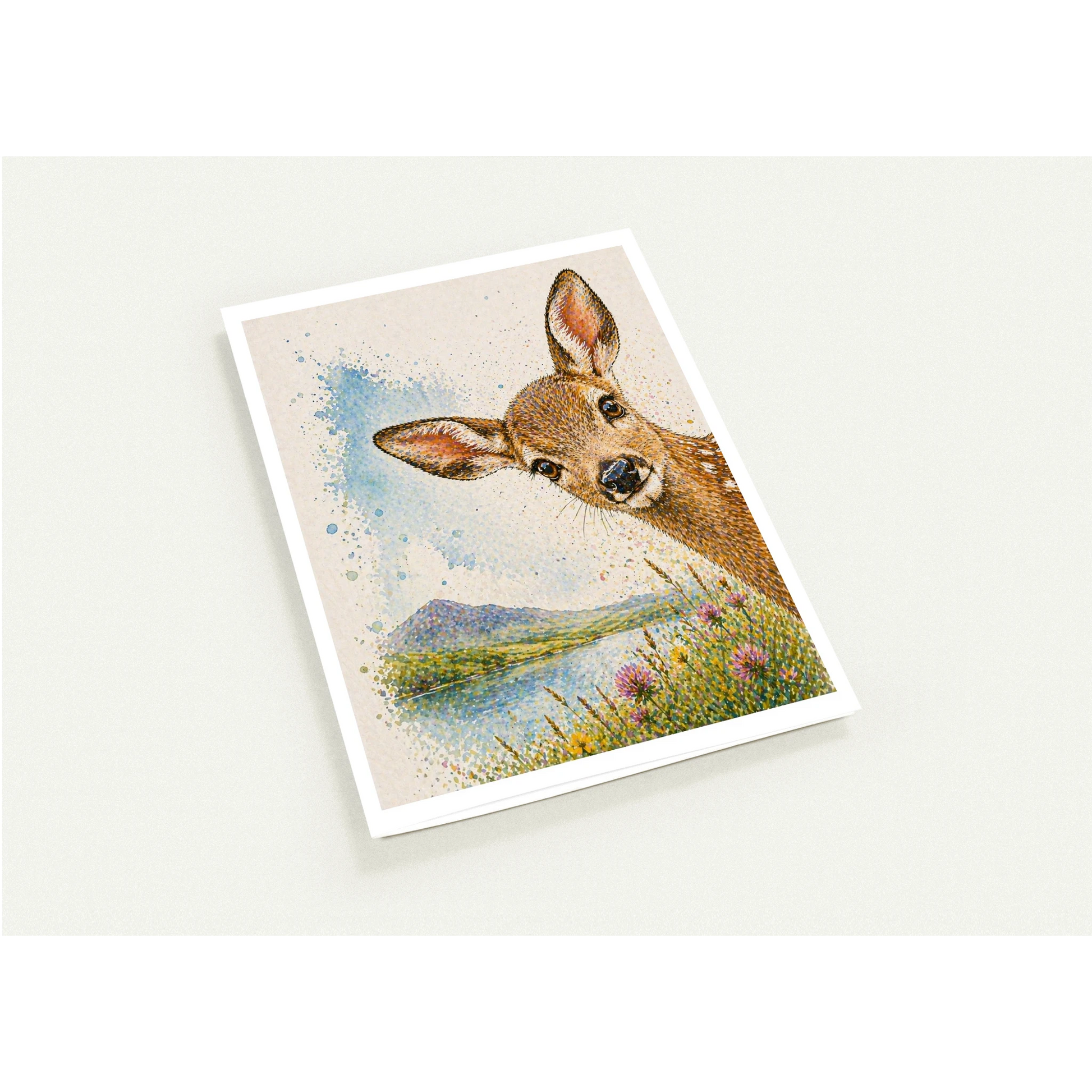 Card with a deer illustration on a scenic background