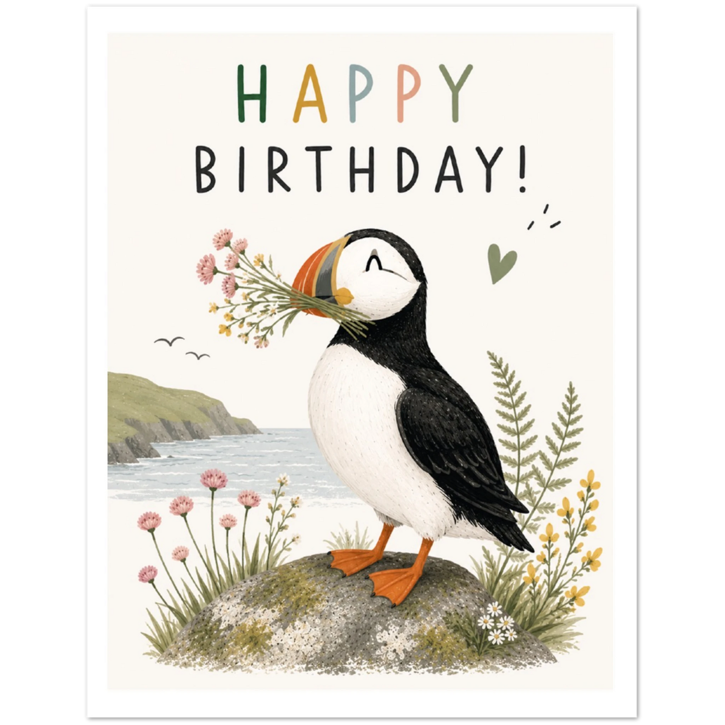 Birthday card with a puffin holding flowers on a coastal background