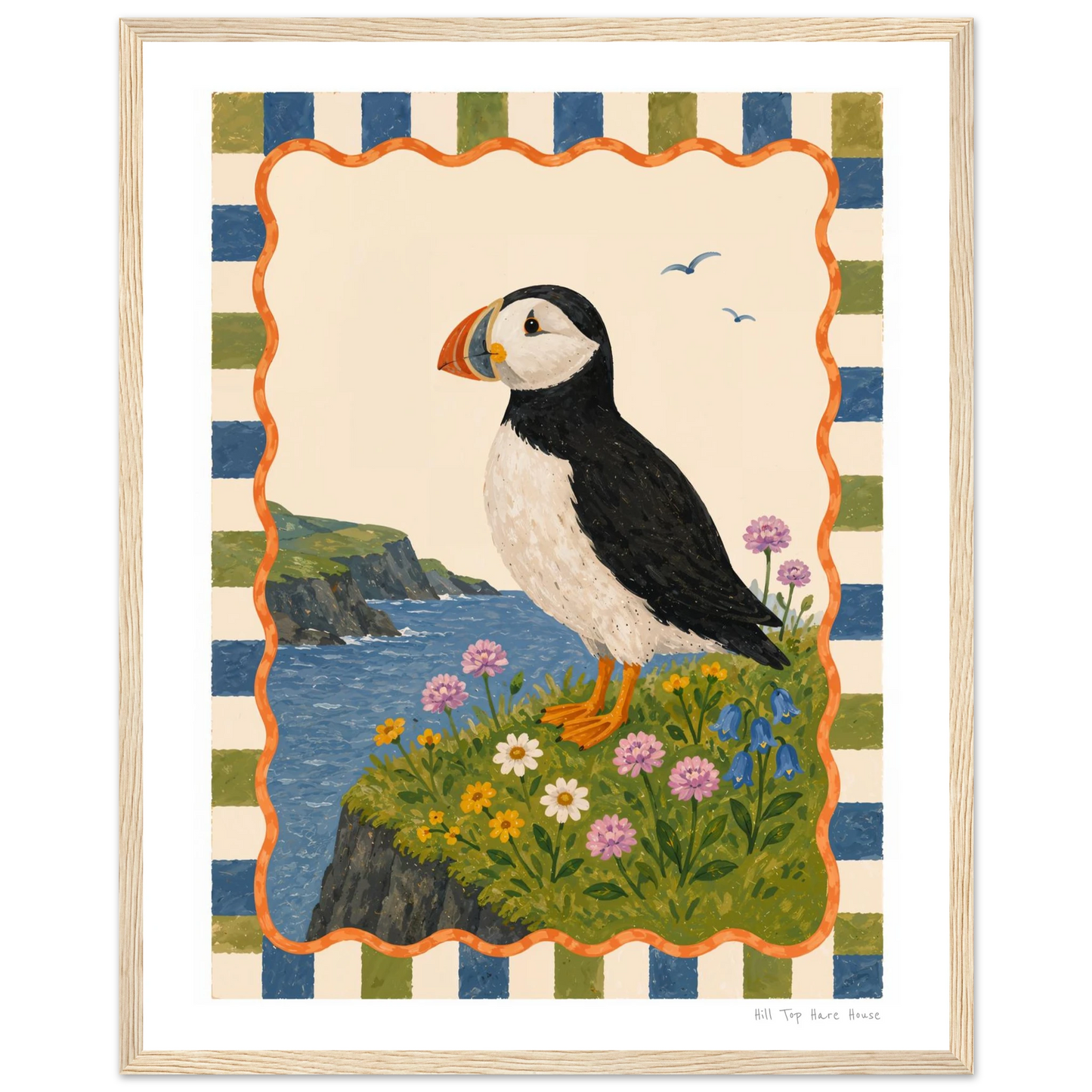 Framed artwork of a puffin on a cliff with flowers and striped border