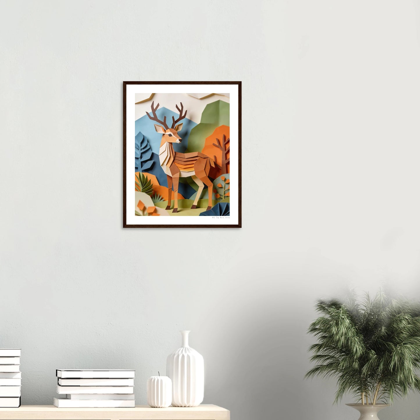 Framed artwork of a deer in a natural setting on a wall above a shelf with decorative items.