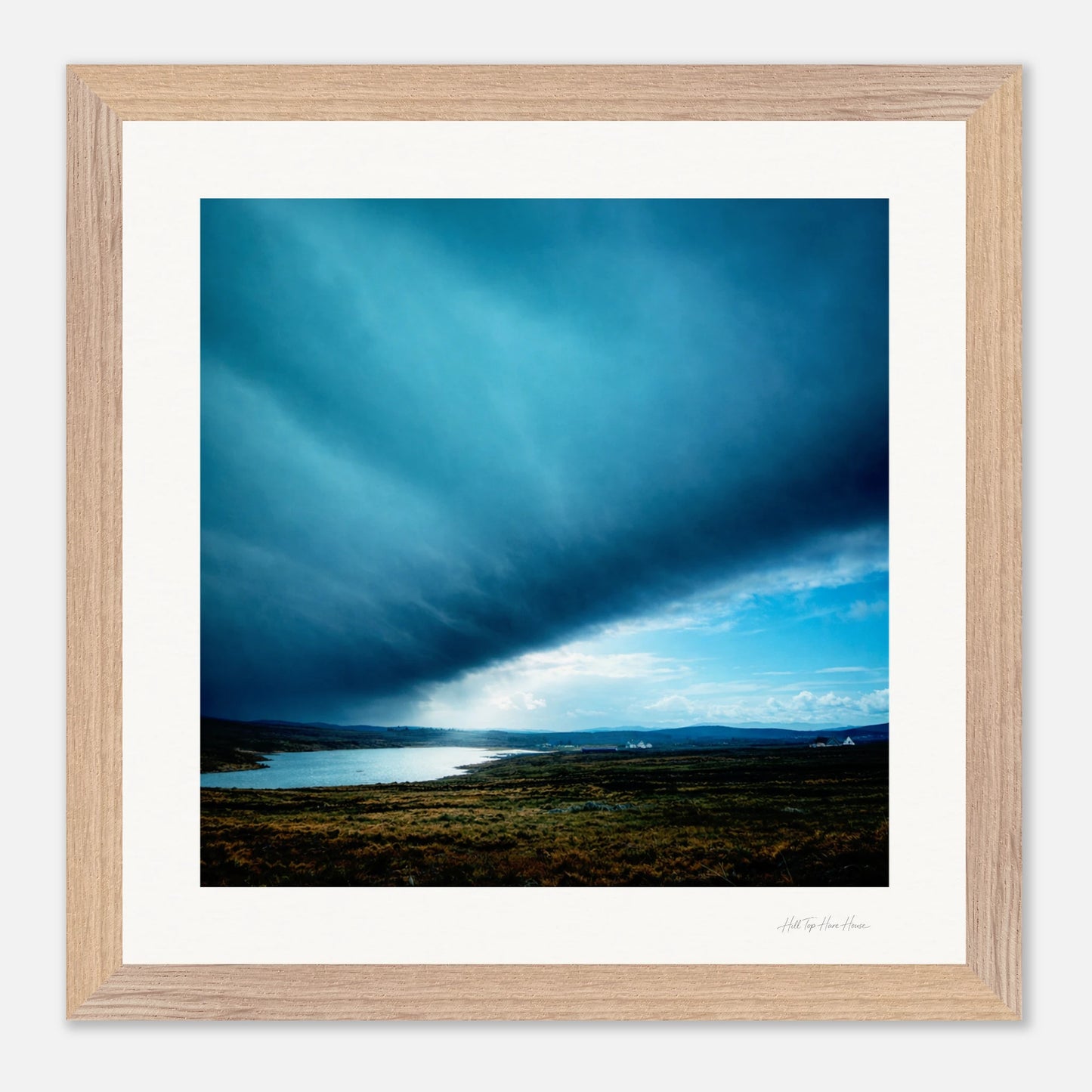 Framed wooden photograph of a storm rolling in Ireland 