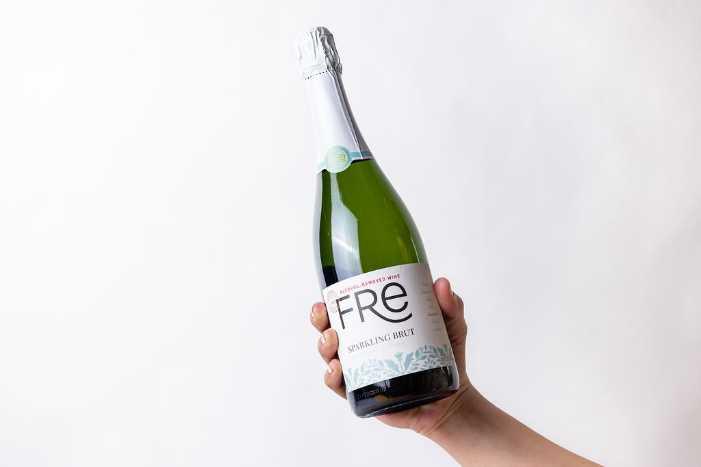 DC-Lizush celebration gift basket with a bottle of Fre Champagne and festive items in a decorative gift box
