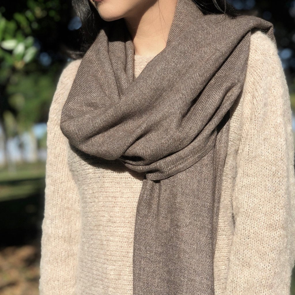 Brown handloom cashmere scarf by DC-SLATE + SALT, showcasing soft, woven texture and elegant drape.