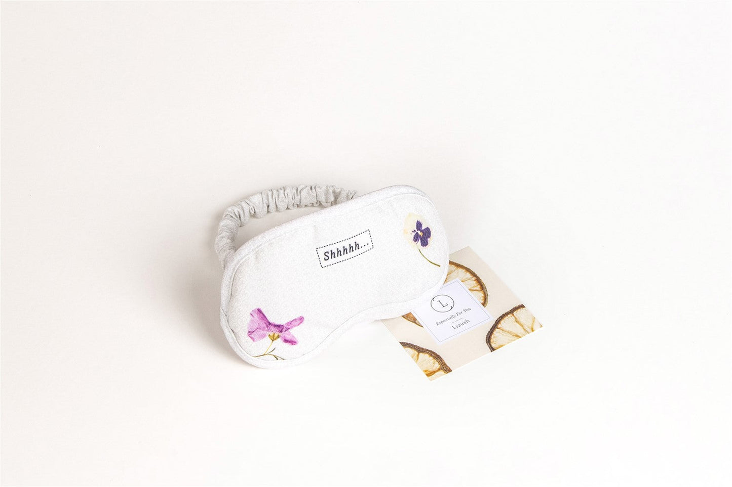 Yellow eye mask from DC-Lizush Natural Citrus Bath & Body Skincare Set, soft fabric with a relaxed, soothing design.