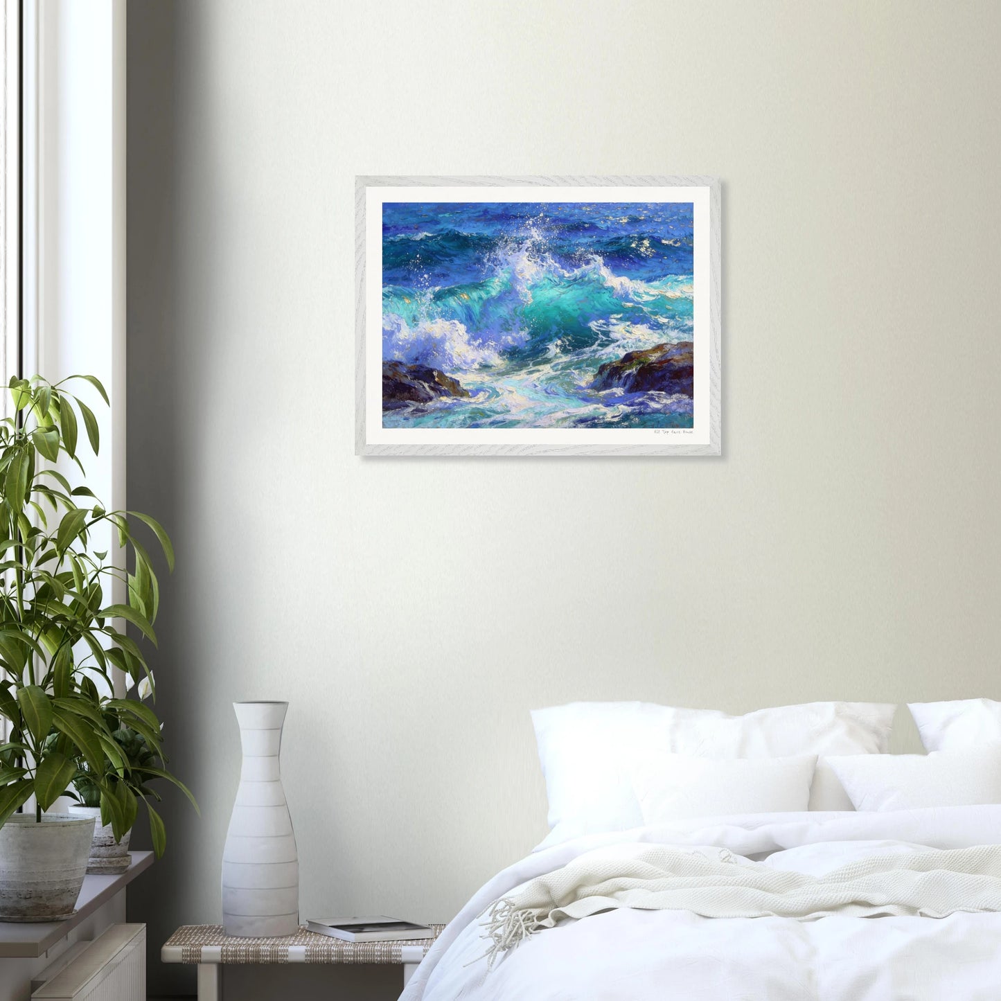 Framed artwork of a seascape above a bed in a bedroom