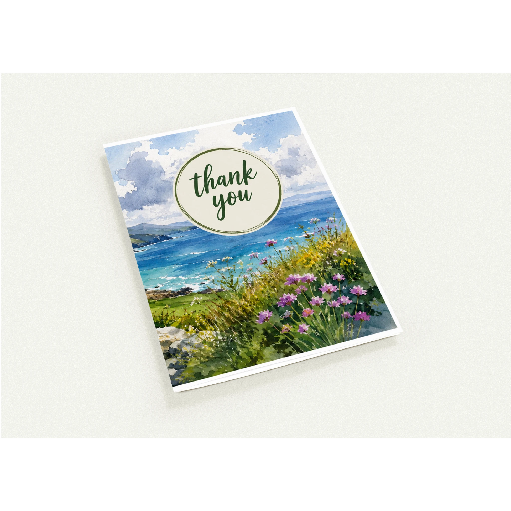 Greeting card with scenic design and 'thank you' text on a white background