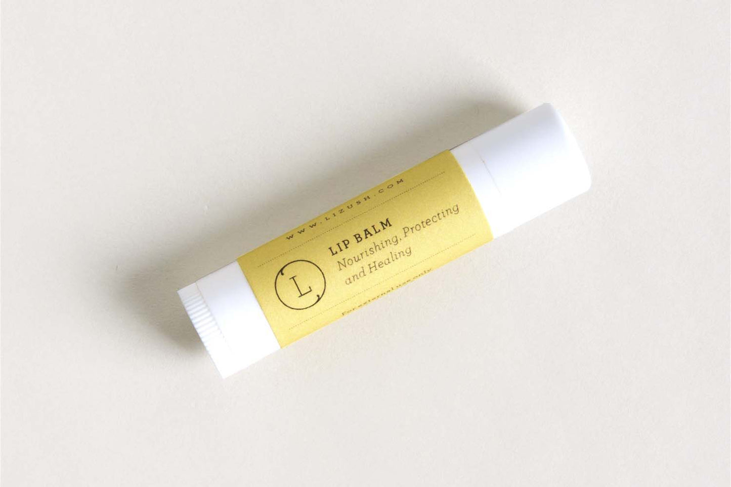 DC-Lizush natural citrus lip balm stick, moisturizing skincare product with citrus scent in a sleek tube.