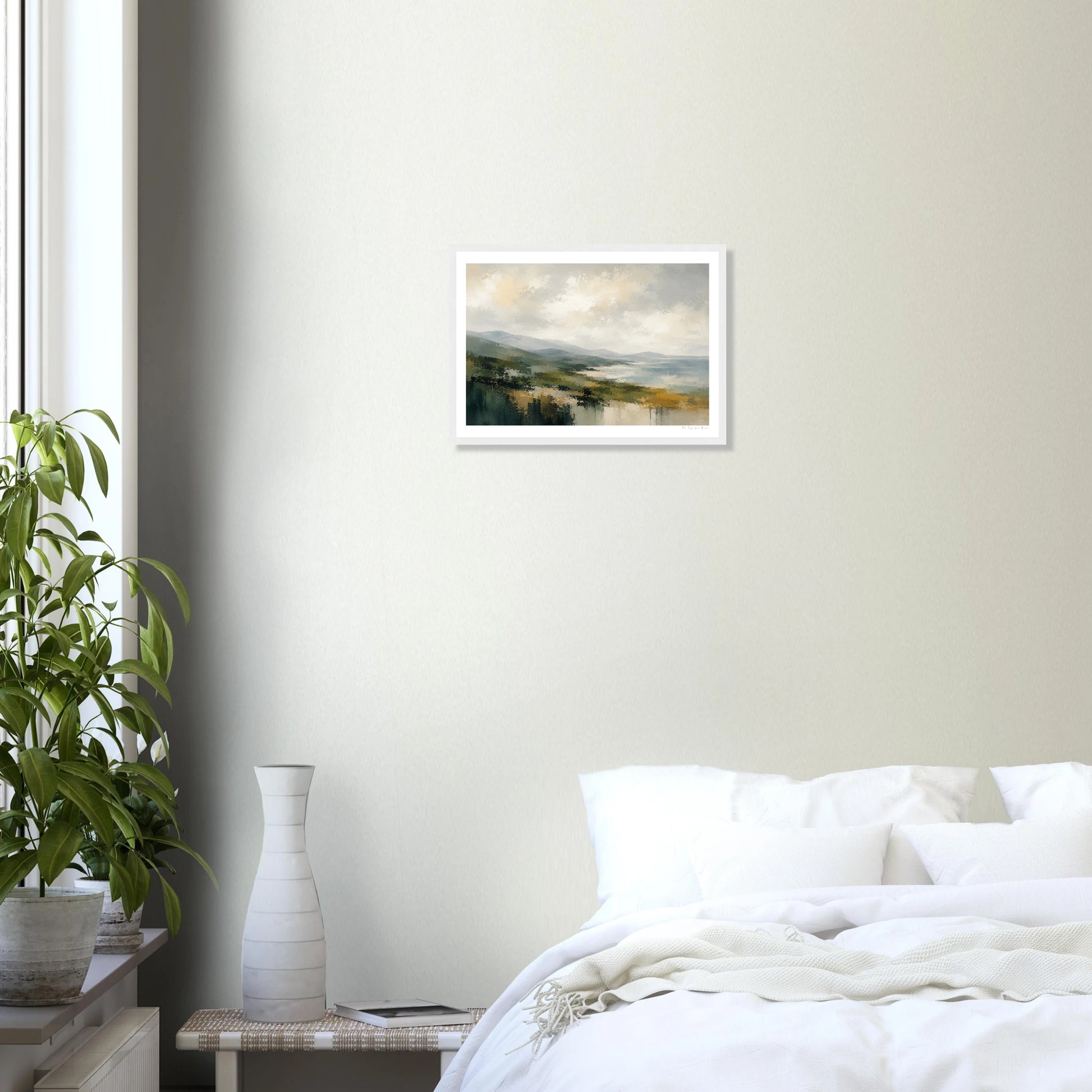 Framed landscape painting on a wall above a bed in a bedroom.