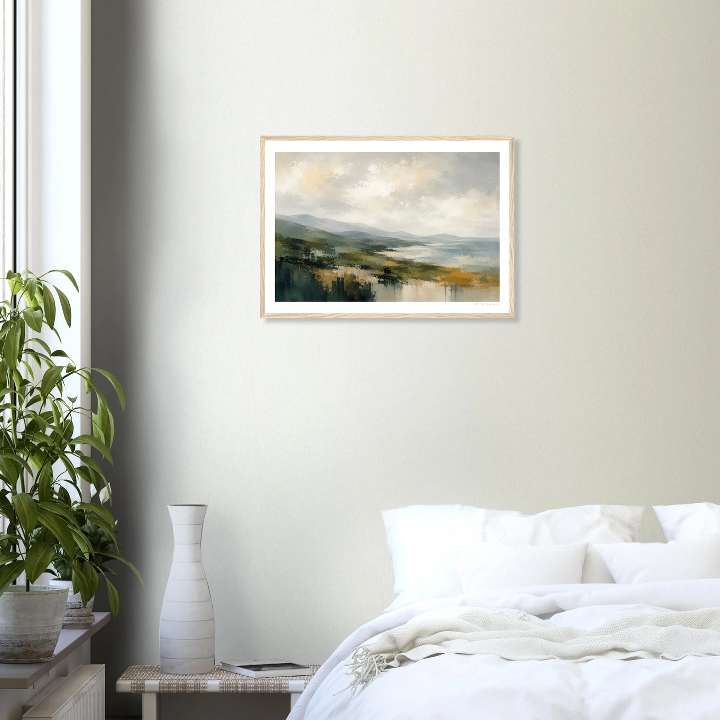 Framed landscape painting on a wall above a bed in a bedroom.