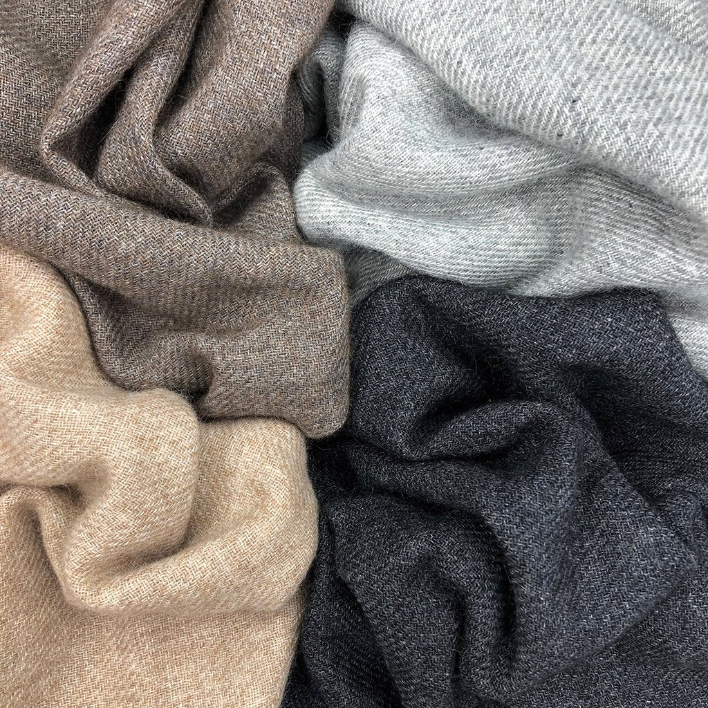 Elegant slate and salt-colored handloom cashmere scarf by DC-SLATE + SALT, showcasing soft, woven texture and classic design.